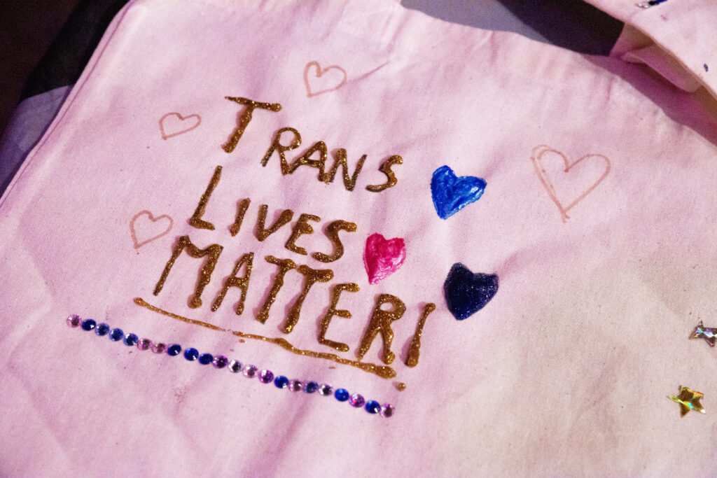 A tote bag with statement "Trans Lives Matter"
