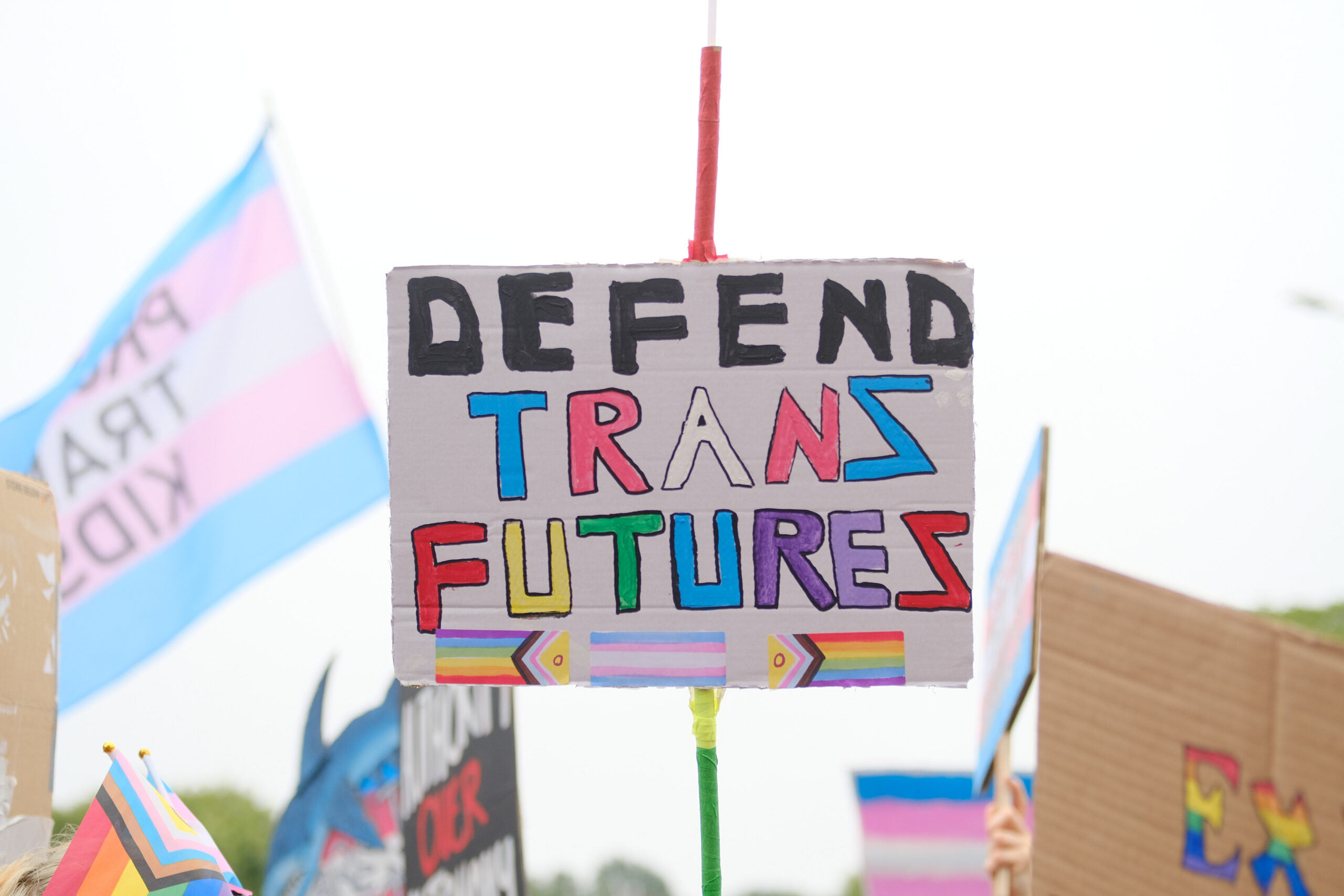 A placard at Pride Edinburgh saying 'Defend Trans Futures'