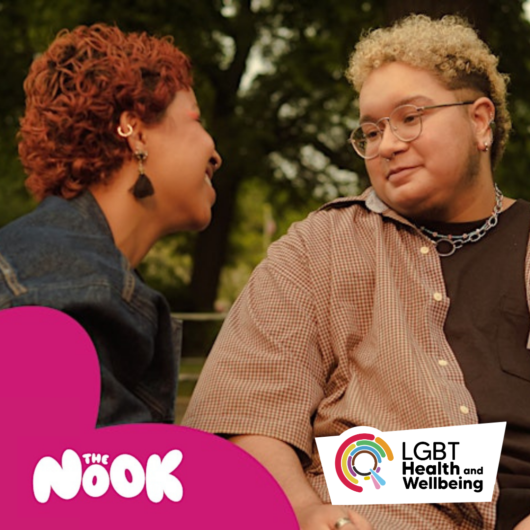 Two people sit together outdoors on a bench, facing each other. In the bottom corners are “The Nook” logo and the LGBT Health and Wellbeing logo on a pink and white background.