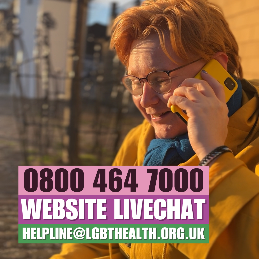 A community member outside in town phoning the helpline.